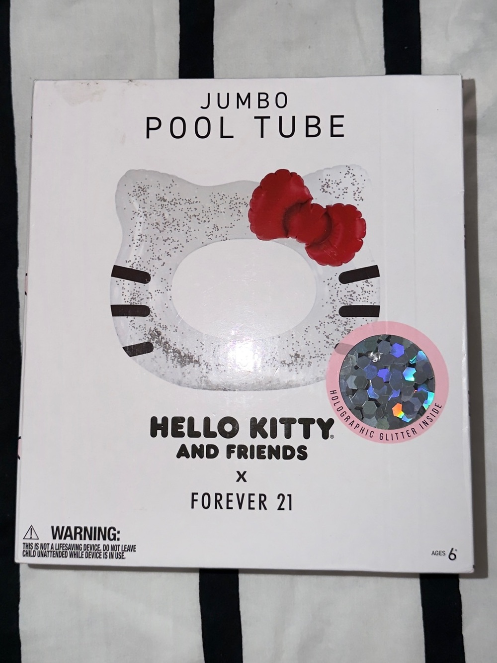 Forever 21 Hello Kitty Silver Glitter Pool Tube with Red Bow Accent